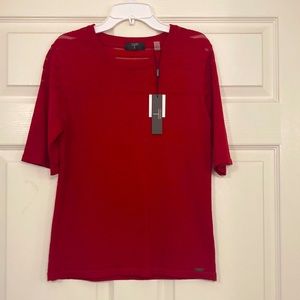 New with tags red short sleeve sweater.  Made of Rayon and Nylon.
